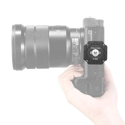 Falcam F38 Quick Release System attached to camera, black aluminum alloy.