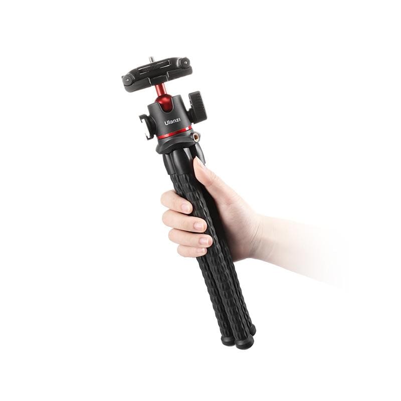 Ulanzi MT-33 Octopus Tripod in hand, black flexible tripod with cold shoe mount.