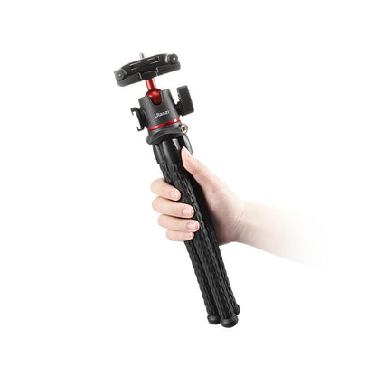 Ulanzi MT-33 Octopus Tripod in hand, black flexible tripod with cold shoe mount.
